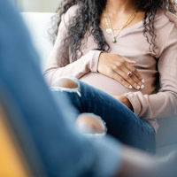Woman holding her pregnant belly